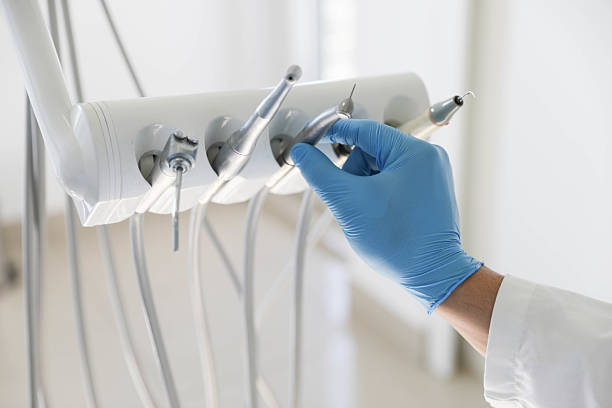 Professional Tooth Extraction technician working in Franklin Grove, IL